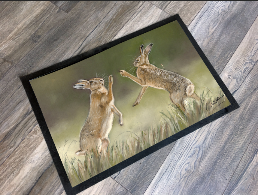 boxing hares artwork by grace scott floor mat